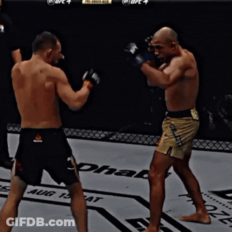 Two Men Fighting In Boxing Ring With UFC 4 GIF