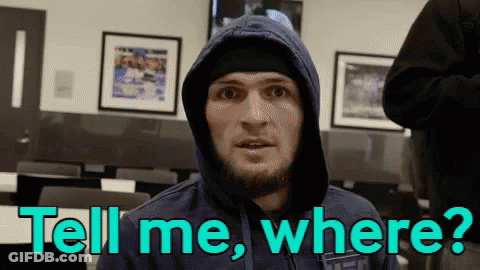 Two Men Fighting In Boxing Ring With UFC Shorts GIF