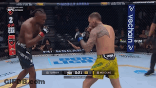 Two Men Fighting In Boxing Ring With VeChain Banner GIF