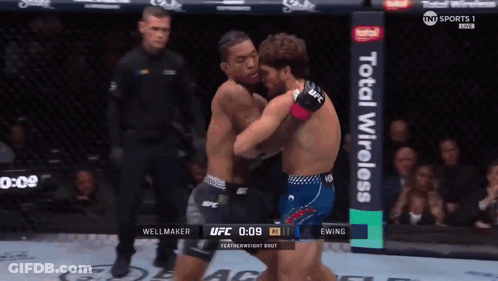 Two Men Fighting In Boxing Ring GIF