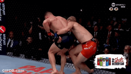 Two Men Fighting In Cage 2 Shots In Every Can GIF