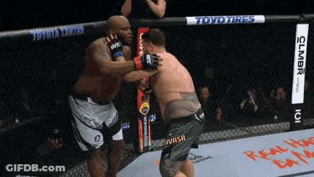 Two Men Fighting In Cage GIF