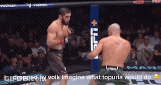 Two Men Fighting In Cage Dropped By Volk Imagine What Topuria Would Do On Bottom GIF