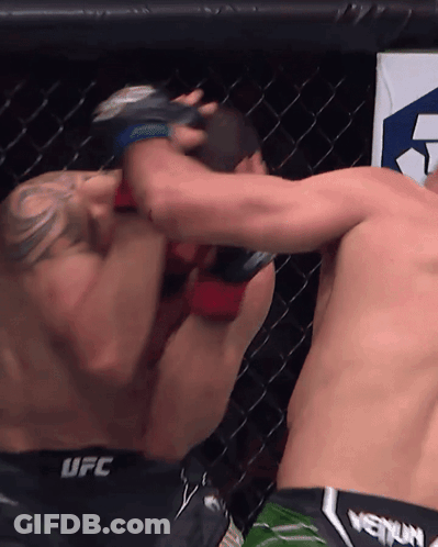 Two Men Fighting In Cage One Wearing UFC Shorts GIF