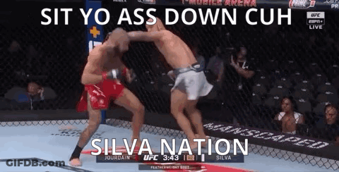 Two Men Fighting In Cage Saying Sit Yo Ass Down Cuh Silva Nation GIF