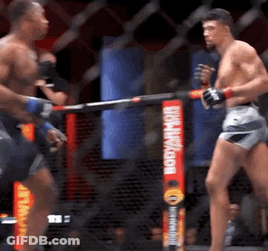 Two Men Fighting In Cage With Bodyarmor Banner GIF