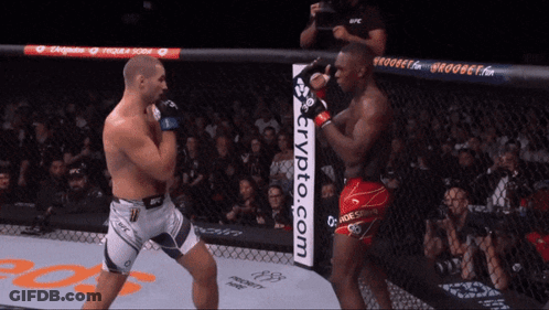 Two Men Fighting In Cage With Crypto.com Sign GIF