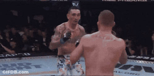 Two Men Fighting In Cage With Vegas Stronger GIF