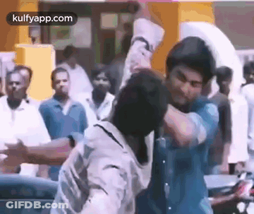 Two Men Fighting In Crowd GIF