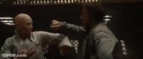 Two Men Fighting In Dark Room GIF