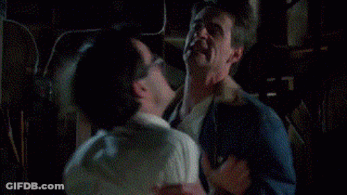 Two Men Fighting In Dark Room GIF