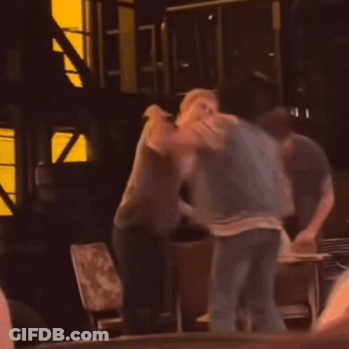 Two Men Fighting In Dark Room GIF