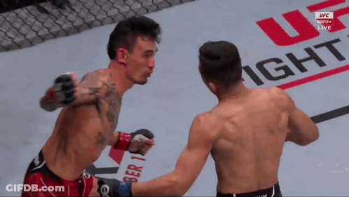 Two Men Fighting In Front Of UFC Fight Sign GIF