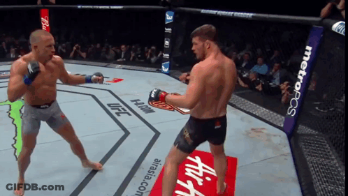 Two Men Fighting In Ring GIF