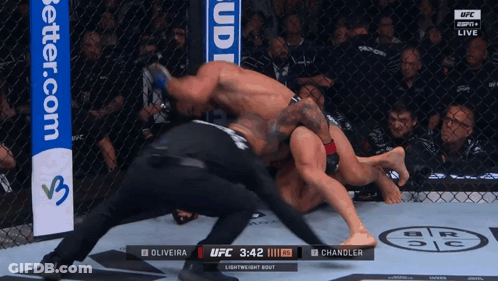 Two Men Fighting In Ring It's MMA Shorts GIF