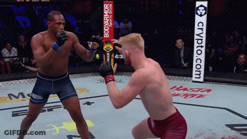 Two Men Fighting In Ring With Bodyarmor Ad GIF