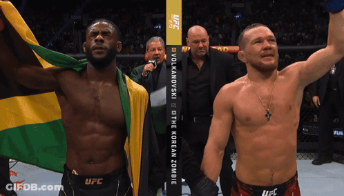 Two Men Fighting In Ring With Bodyarmor Sign GIF