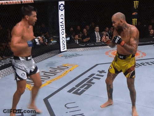 Two Men Fighting In Ring With Crypto.com Sign GIF