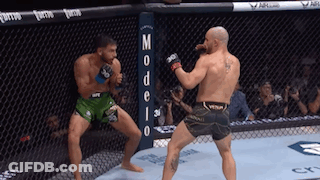 Two Men Fighting In Ring With Modelo Sign GIF