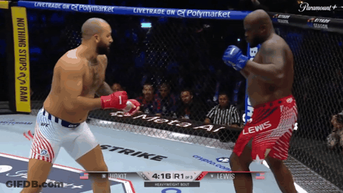 Two Men Fighting In Ring With Paramount Banner GIF