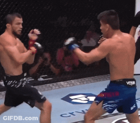 Two Men Fighting In Ring With Venum Belt GIF