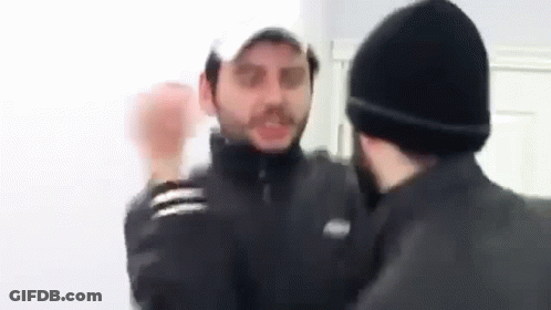 Two Men Fighting In Room GIF