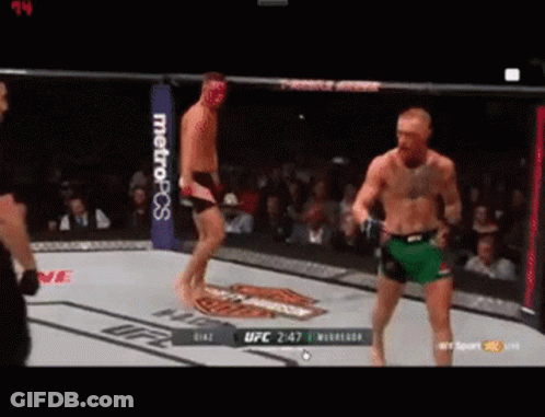 Two Men Fighting In UFC Ring GIF