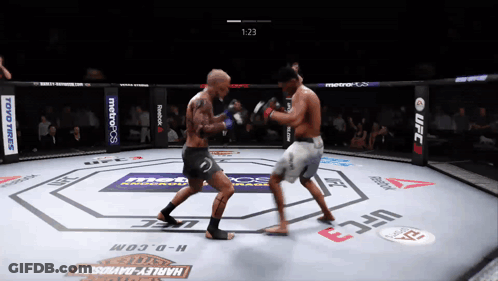 Two Men Fighting In UFC Ring Sponsored By Harley-Davidson And Toyo Tires GIF