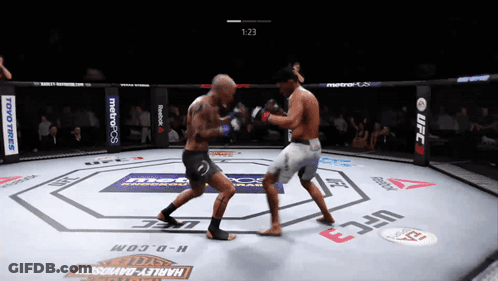 Two Men Fighting In UFC Ring With Harley-Davidson GIF