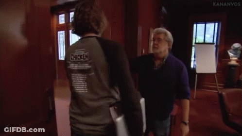 Two Men Fighting One Holding Arm GIF