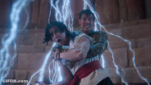 Two Men Fighting With Lightning Behind Them GIF
