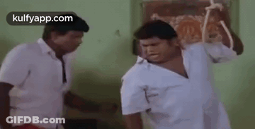 Two Men Fighting With Stick GIF