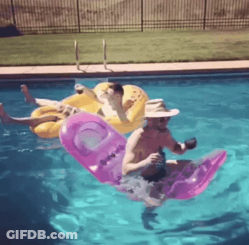 Two Men Floating On Rafts GIF