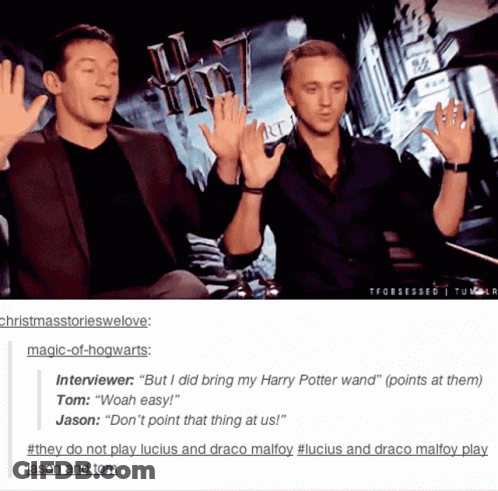 Two Men Giving Each Other High Fives With A Harry Potter Poster In The Background GIF