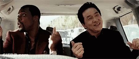 Two Men Giving Thumbs Up In Back Seat GIF