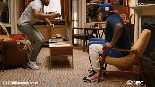 Two Men Having Conversation In Living Room Grandcrew GIF