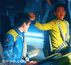 Two Men High Fiving With Caption Testmeyouwillfail GIF