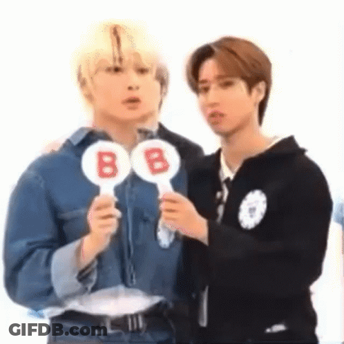 Two Men Holding B Signs GIF
