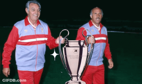 Two Men Holding Champions League Trophy GIF
