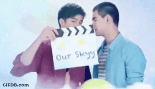 Two Men Holding Clapper Board Over Faces GIF