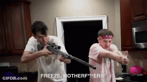 Two Men Holding Guns In Kitchen Saying Freeze Motherf**er GIF
