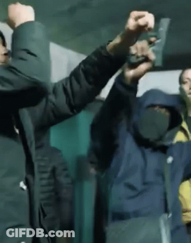 Two Men Holding Guns Right And Left GIF