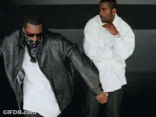 Two Men Holding Hands GIF
