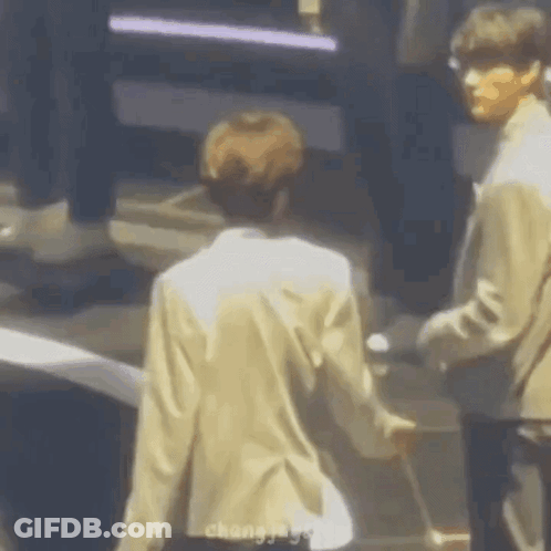 Two Men Holding Hands GIF