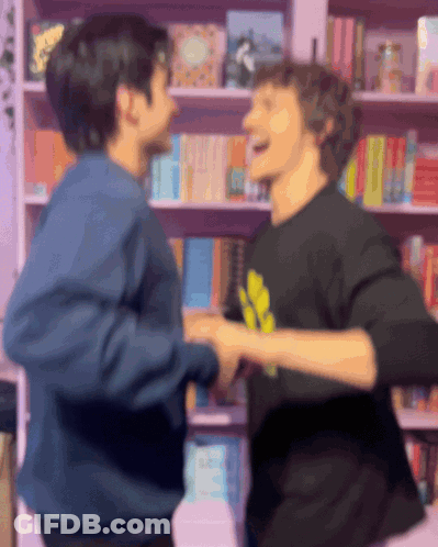 Two Men Holding Hands GIF