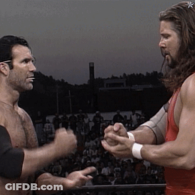 Two Men Holding Hands In Front Of Crowd GIF