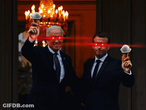 Two Men Holding Ice Cream Cones With Red Eyes And Chandelier GIF