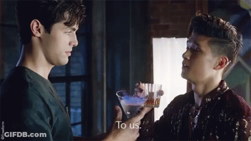 Two Men Holding Martini Glass Talking GIF