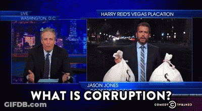 Two Men Holding Money Bags Saying What Is Corruption GIF
