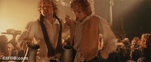 Two Men Holding Pitchers In A Crowd GIF